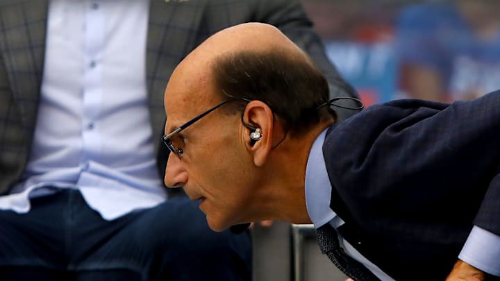 SEC Nation host Paul Finebaum stares down a live alligator