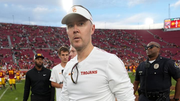 Nov 30, 2024; Los Angeles, California, USA; Southern California Trojans head coach Lincoln Riley leaves the field after the game against the Notre Dame Fighting Irish at United Airlines Field at Los Angeles Memorial Coliseum. Mandatory Credit: Kirby Lee-Imagn Images
