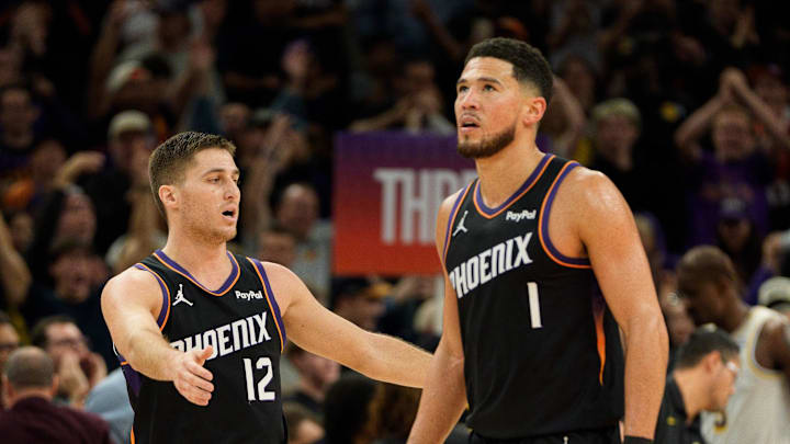 Dec 14, 2025; Phoenix, Arizona, USA; Phoenix Suns guard Devin Booker (1) and guard Collin Gillespie (12) react after the Sun take the lead late in the second half of a game against the Los Angeles Lakers at Mortgage Matchup Center. Mandatory Credit: Allan Henry-Imagn Images Dec 14, 2025; Phoenix, Arizona, USA; Phoenix Suns guard Devin Booker (1) and guard Collin Gillespie (12) react after the Sun take the lead late in the second half of a game against the Los Angeles Lakers at Mortgage Matchup Center. Mandatory Credit: Allan Henry-Imagn Images