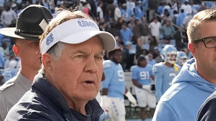 Oct 25, 2025; Chapel Hill, North Carolina, USA; North Carolina Tar Heels head coach Bill Belichick shakes Virginia Cavaliers head coach Tony Elliott hand after the Tar Heels lose to Virginia in overtime at Kenan Stadium. Mandatory Credit: Bob Donnan-Imagn Images Oct 25, 2025; Chapel Hill, North Carolina, USA; North Carolina Tar Heels head coach Bill Belichick shakes Virginia Cavaliers head coach Tony Elliott hand after the Tar Heels lose to Virginia in overtime at Kenan Stadium. Mandatory Credit: Bob Donnan-Imagn Images