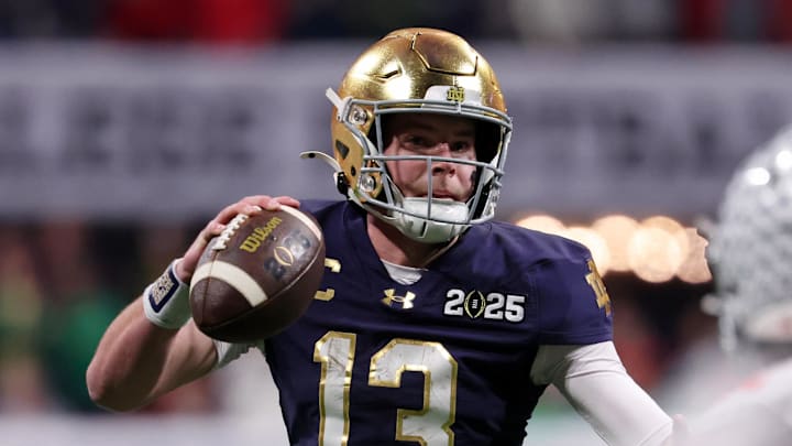 Jan 20, 2025; Atlanta, GA, USA; Notre Dame Fighting Irish quarterback Riley Leonard (13) looks to pass the ball against the Ohio State Buckeyes during the first half the CFP National Championship college football game at Mercedes-Benz Stadium. 