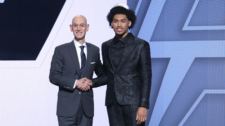 Jun 25, 2025; Brooklyn, NY, USA; Dylan Harper stands with NBA commissioner Adam Silver after being selected as the second pick by the San Antonio Spurs in the first round of the 2025 NBA Draft at Barclays Center.