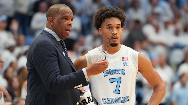 Nov 7, 2025; Chapel Hill, North Carolina, USA; North Carolina Tar Heels head coach Hubert Davis with guard Seth Trimble (7) in the second half at Dean E. Smith Center. Mandatory Credit: Bob Donnan-Imagn Images Nov 7, 2025; Chapel Hill, North Carolina, USA; North Carolina Tar Heels head coach Hubert Davis with guard Seth Trimble (7) in the second half at Dean E. Smith Center. Mandatory Credit: Bob Donnan-Imagn Images