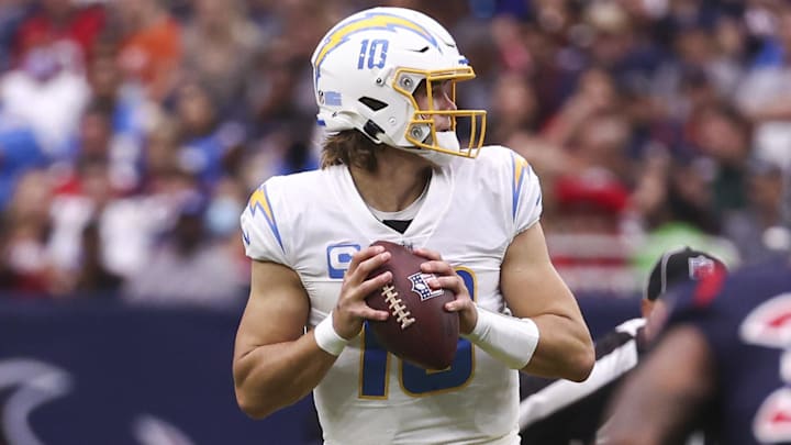 Dec 26, 2021; Houston, Texas, USA; Los Angeles Chargers quarterback Justin Herbert (10) looks for an open receiver during the second quarter against the Houston Texans at NRG Stadium. Mandatory Credit: Troy Taormina-Imagn Images Dec 26, 2021; Houston, Texas, USA; Los Angeles Chargers quarterback Justin Herbert (10) looks for an open receiver during the second quarter against the Houston Texans at NRG Stadium. Mandatory Credit: Troy Taormina-Imagn Images