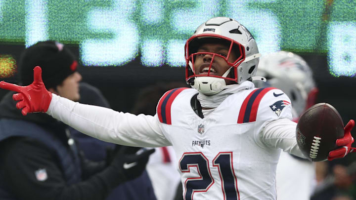 Dec 28, 2025; East Rutherford, New Jersey, USA; New England Patriots safety Jaylinn Hawkins (21) celebrates an interception against the New York Jets during the first quarter of the game at MetLife Stadium. Mandatory Credit: Vincent Carchietta-Imagn Images