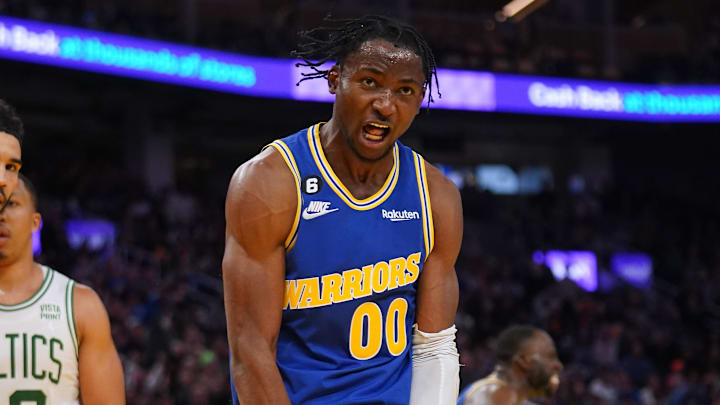 Dec 10, 2022; San Francisco, California, USA; Golden State Warriors forward Jonathan Kuminga (00) reacts after making a basket against Boston Celtics forward Jayson Tatum (0) in the fourth quarter at the Chase Center. Mandatory Credit: Cary Edmondson-Imagn Images