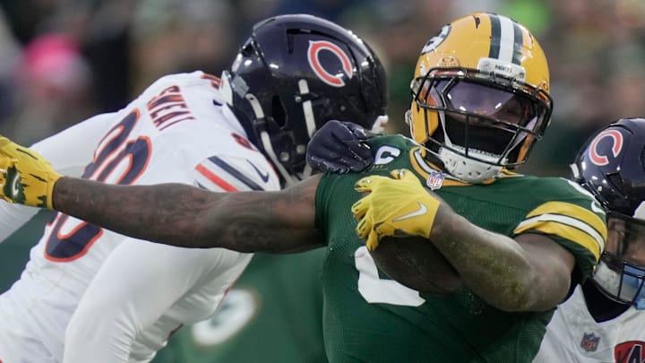 Green Bay Packers running back Josh Jacobs (8) runs for a first down against the Chicago Bears. Green Bay Packers running back Josh Jacobs (8) runs for a first down against the Chicago Bears.