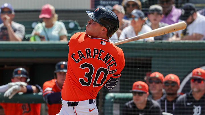 Detroit Tigers left fielder Kerry Carpenter (30) takes a swing at the plate in spring training. 