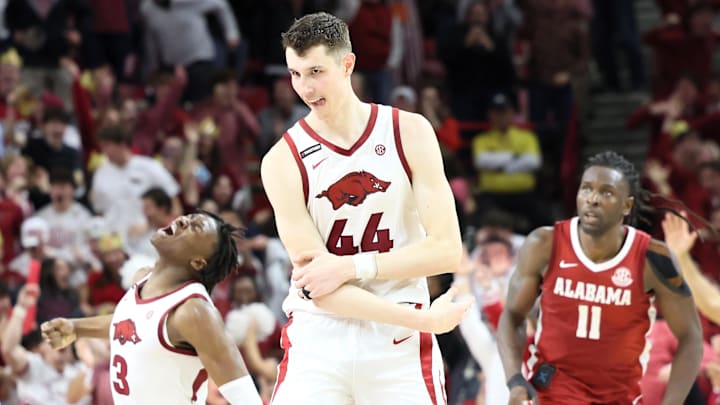 Arkansas Razorbacks forwards Zvonimir Ivisic (44) and Adou Thiero (3) celebrate after one of Big Z's four 3-pointers. The Hogs trailed No. 3 Alabama by 18 with 6:27 left but a furious rally got Arkansas within three in the final seconds before losing 85-81 at Bud Walton Arena Saturday night.