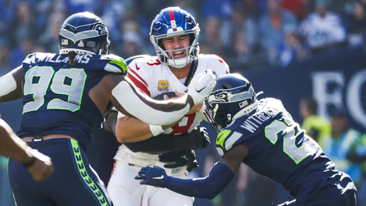 Oct 6, 2024; Seattle, Washington, USA; New York Giants quarterback Daniel Jones (8) rushes against the Seattle Seahawks during the second quarter at Lumen Field. Mandatory Credit: Joe Nicholson-Imagn Images