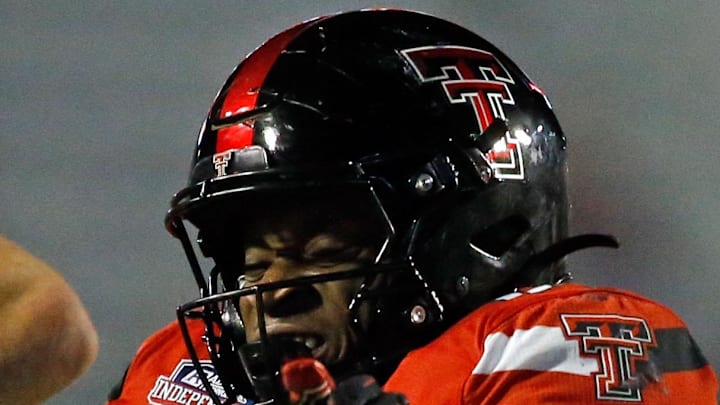 Dec 16, 2023; Shreveport, LA, USA; Texas Tech Red Raiders linebacker Joseph Adedire (14) sacks California Golden Bears quarterback Fernando Mendoza (15) during the second half at Independence Stadium. Mandatory Credit: Petre Thomas-Imagn Images