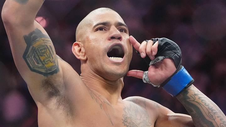 Oct 4, 2025; Las Vegas, Nevada, UNITED STATES; Alex Pereira (blue gloves) reacts after the fight against Magomed Ankalaev (red gloves) during UFC 320 at T-Mobile Arena. Mandatory Credit: Stephen R. Sylvanie-Imagn Images