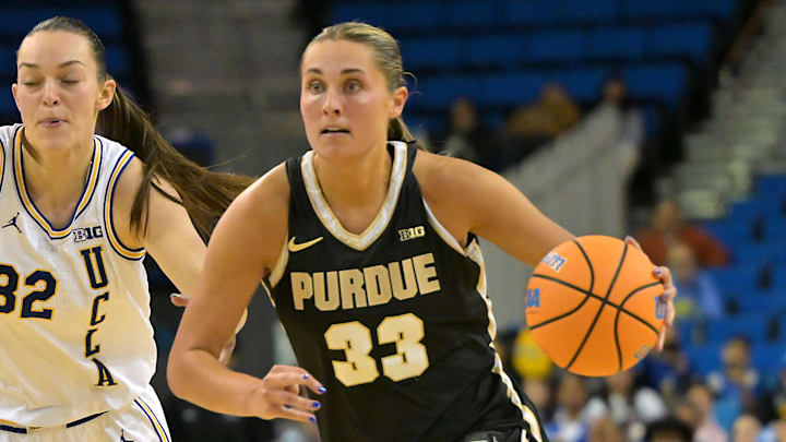 Purdue Boilermakers guard Madison Layden-Zay (33) drives past UCLA Bruins forward Angela Dugalic. Purdue Boilermakers guard Madison Layden-Zay (33) drives past UCLA Bruins forward Angela Dugalic.
