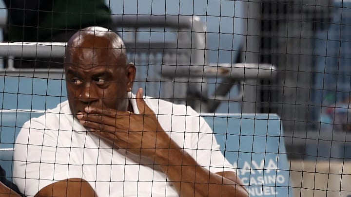 Vanessa Bryant (bottom row middle) and her family and Magic Johnson (top row right) attend the game between the Los Angeles Dodgers and the San Francisco Giants at Dodger Stadium on Sept. 19.