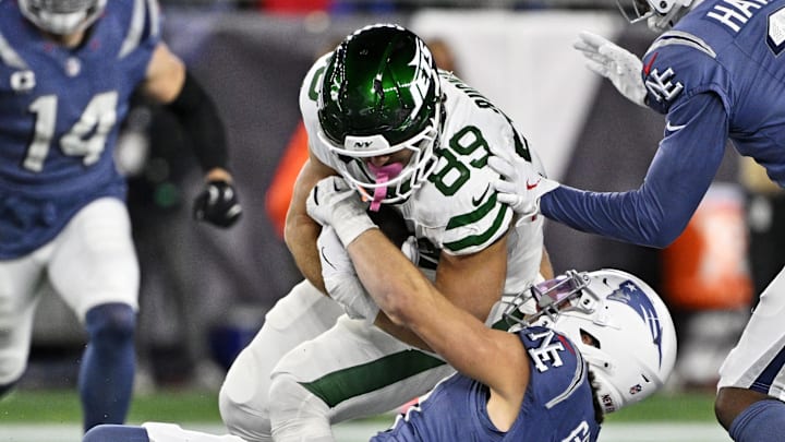 New York Jets tight end Jeremy Ruckert is tackled by New England Patriots linebacker Jack Gibbens.