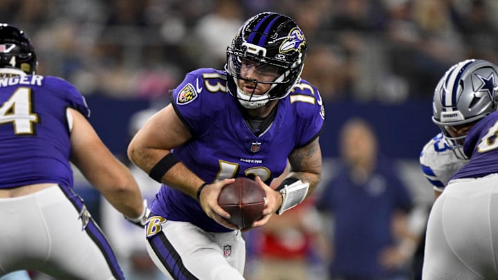Aug 16, 2025; Arlington, Texas, USA; Baltimore Ravens quarterback Devin Leary (13) hands the ball off during the game between the Dallas Cowboys and the Baltimore Ravens at AT&T Stadium. Mandatory Credit: Jerome Miron-Imagn Images