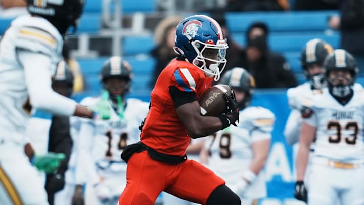 Christian Academy of Louisville's JaHyde Brown (1) runs for a big gain against Murray in the first half at the KHSAA class 3A football state final at Kroger Field in Lexington Saturday, December 6, 2025.