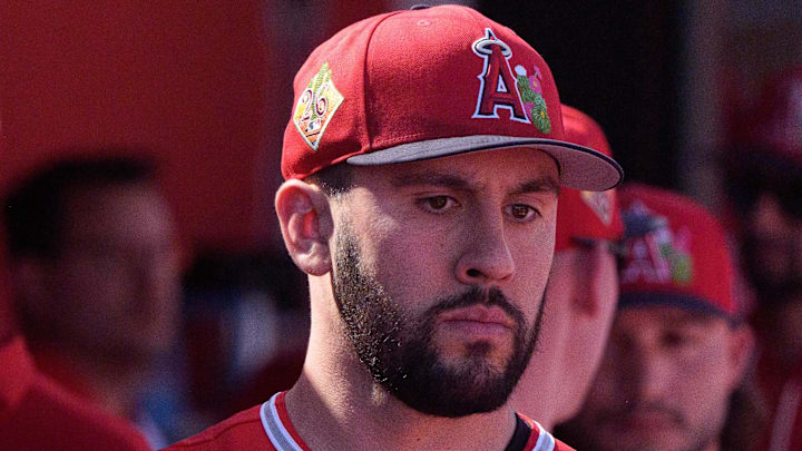 Feb 24, 2026; Tempe, Arizona, USA; Los Angeles Angels pitcher Grayson Rodriguez (21) reacts in the dugout with his team after being relieved in the second inning against the San Francisco Giants during a spring training game at Tempe Diablo Stadium. Mandatory Credit: Allan Henry-Imagn Images
