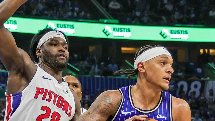 Orlando Magic forward Paolo Banchero looks to pass in front of Detroit Pistons forward Isaiah Stewart.