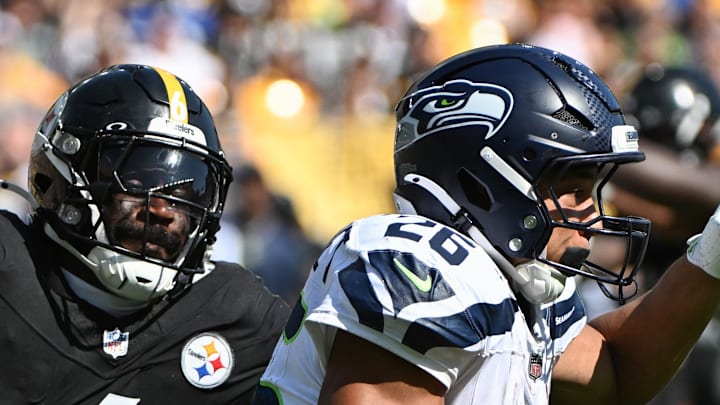 Pittsburgh Steelers linebacker Patrick Queen looks to tackle Seattle Seahawks running back Zach Charbonnet.