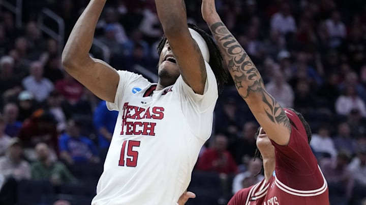 Mar 27, 2025; San Francisco, CA, USA; Texas Tech Red Raiders forward JT Toppin (15) drives to the hoop past Arkansas Razorbacks forward Trevon Brazile (4) during the first half during a West Regional semifinal of the 2025 NCAA tournament at Chase Center. Mandatory Credit: Kyle Terada-Imagn Images
