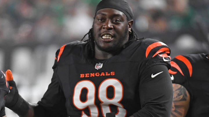 Aug 7, 2025; Philadelphia, Pennsylvania, USA; Cincinnati Bengals defensive tackle Kris Jenkins Jr. (90) and  defensive tackle T.J. Slaton Jr. (98) walk off the field at halftime against the Philadelphia Eagles at Lincoln Financial Field. Mandatory Credit: Eric Hartline-Imagn Images