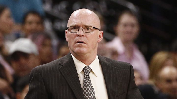 Former Orlando Magic head coach Scott Skiles watches from the sidelines during the second half against the San Antonio Spurs at AT&T Center.