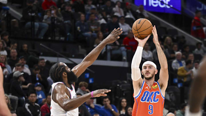 Nov 2, 2024; Inglewood, California, USA; Oklahoma City Thunder guard Alex Caruso (9) shoots against LA Clippers guard James Harden (1) during the second half at Intuit Dome. Mandatory Credit: Jonathan Hui-Imagn Images Nov 2, 2024; Inglewood, California, USA; Oklahoma City Thunder guard Alex Caruso (9) shoots against LA Clippers guard James Harden (1) during the second half at Intuit Dome. Mandatory Credit: Jonathan Hui-Imagn Images