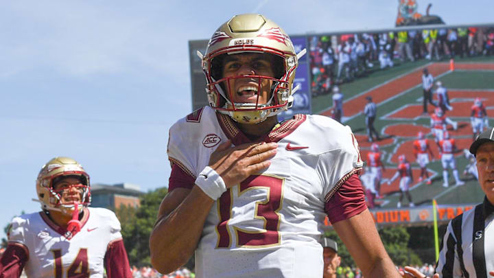 Sep 23, 2023; Clemson, South Carolina, USA; Florida State Seminoles quarterback Jordan Travis (13) reacts after scoring against the Clemson Tigers during the second quarter at Memorial Stadium. Mandatory Credit: Ken Ruinard-Imagn Images