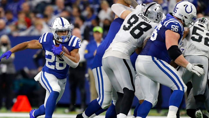 Indianapolis Colts running back Jonathan Taylor (28) rushes the ball Sunday, Jan. 2, 2022, during a game against the Las Vegas Raiders at Lucas Oil Stadium in Indianapolis.