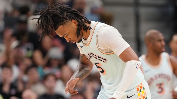Apr 13, 2025; San Antonio, Texas, USA; San Antonio Spurs guard Stephon Castle (5) reacts after scoring a 3-point basket during the first half against the Toronto Raptors at Frost Bank Center.