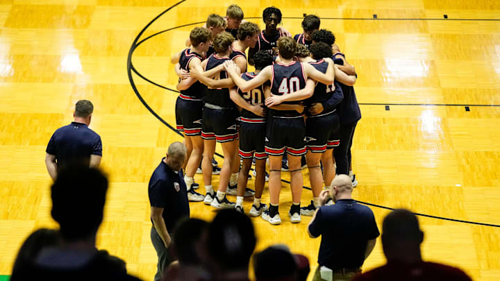 Terre Haute North Vigo players gather together Saturday, March 22, 2025, ahead of the game at New Castle Fieldhouse in New Castle. The Lawrence North Wildcats defeated the Terre Haute North Vigo, 75-56.