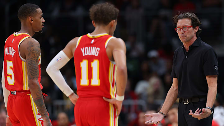 Atlanta Hawks guards Dejounte Murray and Trae Young and head coach Quin Snyder