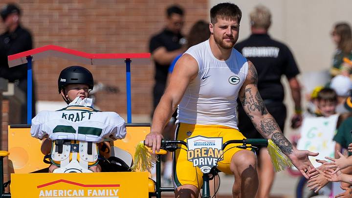Green Bay Packers tight end Tucker Kraft rides a bicycle to a joint practice with the Arizona Cardinals. Green Bay Packers tight end Tucker Kraft rides a bicycle to a joint practice with the Arizona Cardinals.