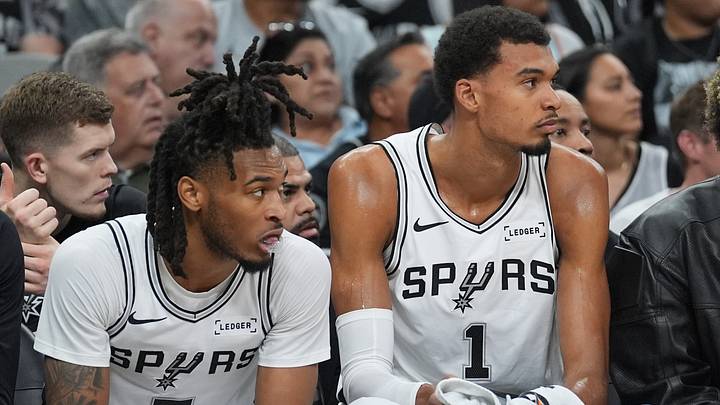 Oct 26, 2025; San Antonio, Texas, USA; San Antonio Spurs guard Stephon Castle (5) and San Antonio Spurs forward Victor Wembanyama (1) look on in the first half against the Brooklyn Nets at Frost Bank Center. Mandatory Credit: Daniel Dunn-Imagn Images