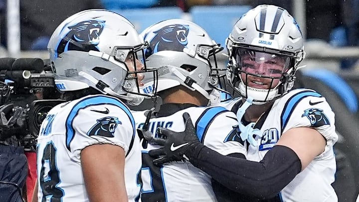 Carolina Panthers quarterback Bryce Young (9) is congratulated on his score by wide receiver Adam Thielen (19) during the second half against the Dallas Cowboys at Bank of America Stadium.