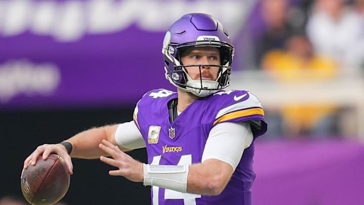 Dec 1, 2024; Minneapolis, Minnesota, USA; Minnesota Vikings quarterback Sam Darnold (14) passes against the Arizona Cardinals in the second quarter at U.S. Bank Stadium. Mandatory Credit: Brad Rempel-Imagn Images