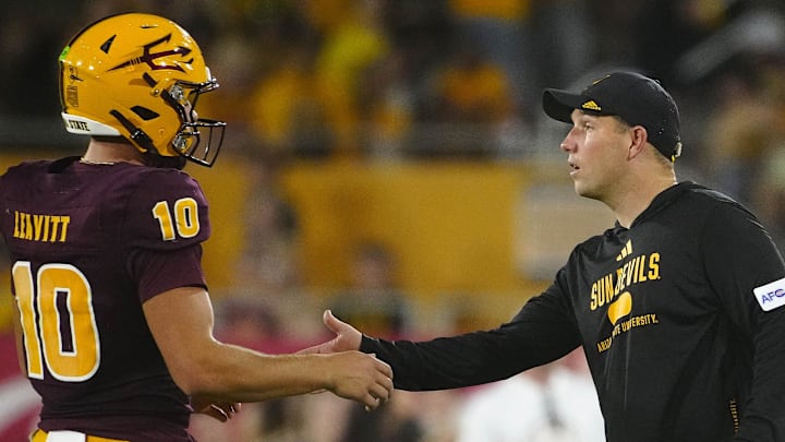 ASU head coach Kenny Dillingham greets quarterback Sam Leavitt (10) during a game against Wyoming at Sun Devil Stadium in Tempe on Aug. 31, 2024.