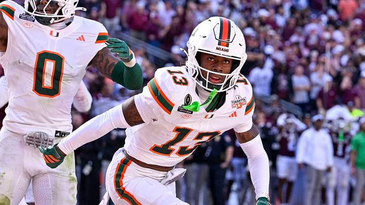 Dec 20, 2025; College Station, TX, USA; Miami Hurricanes defensive back Ethan O'Connor (24) and defensive back Keionte Scott (0) and defensive back Bryce Fitzgerald (13) celebrate after Fitzgerald intercepts a Texas A&M Aggies pass in the end zone during the game between the Aggies and the Hurricanes at Kyle Field. Mandatory Credit: Jerome Miron-Imagn Images Dec 20, 2025; College Station, TX, USA; Miami Hurricanes defensive back Ethan O'Connor (24) and defensive back Keionte Scott (0) and defensive back Bryce Fitzgerald (13) celebrate after Fitzgerald intercepts a Texas A&M Aggies pass in the end zone during the game between the Aggies and the Hurricanes at Kyle Field. Mandatory Credit: Jerome Miron-Imagn Images