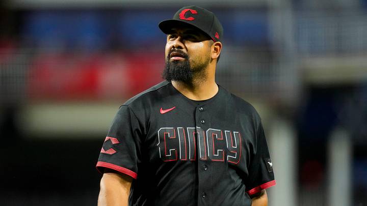 Cincinnati Reds pitcher Tony Santillan (64) walks for the dugout