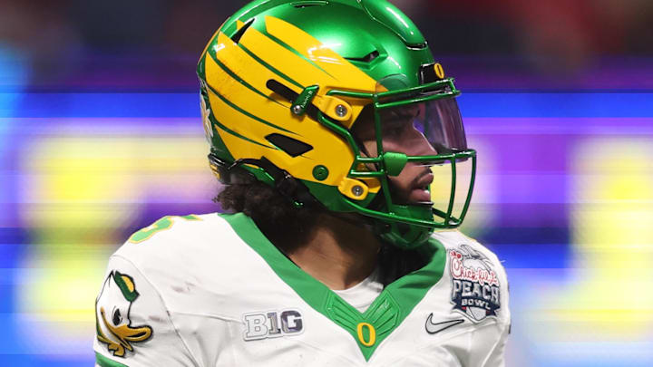 Jan 9, 2026; Atlanta, GA, USA; Oregon Ducks quarterback Dante Moore (5) reacts after a fumble against the Indiana Hoosiers during the first half of the 2025 Peach Bowl and semifinal game of the College Football Playoff at Mercedes-Benz Stadium. Mandatory Credit: Brett Davis-Imagn Images