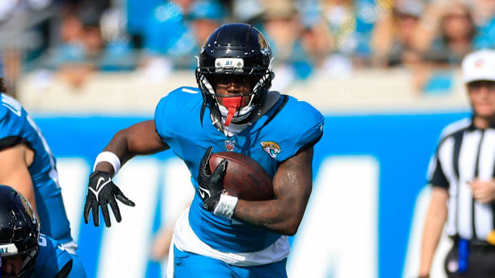 Jacksonville Jaguars running back Travis Etienne Jr. (1) rushes for yards during the first quarter of an NFL football AFC Wild Card playoff matchup, Sunday, Jan. 11, 2026, in Jacksonville, Fla. The Bills defeated the Jaguars 27-24. [Corey Perrine/Florida Times-Union]