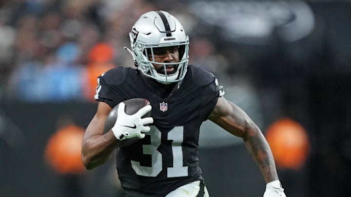 Nov 2, 2025; Paradise, Nevada, USA; Las Vegas Raiders running back Raheem Mostert (31) runs the ball during the second half against the Jacksonville Jaguars at Allegiant Stadium. Mandatory Credit: Kirby Lee-Imagn Images