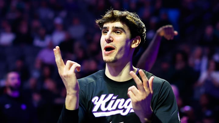 Jan 20, 2026; Sacramento, California, USA; Sacramento Kings center Maxime Raynaud (42) is greeted by teammates during player introductions before the game against the Miami Heat at Golden 1 Center. Mandatory Credit: Sergio Estrada-Imagn Images