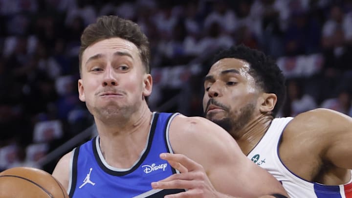 Orlando Magic forward Franz Wagner dribbles defended by Detroit Pistons forward Tobias Harris