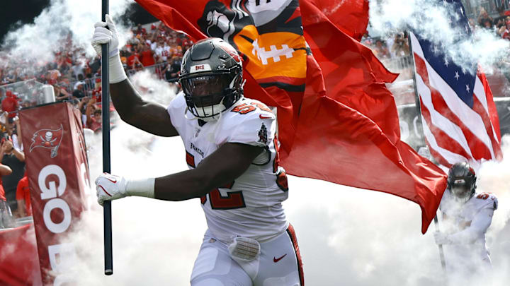 Sep 8, 2024; Tampa, Florida, USA;  Tampa Bay Buccaneers linebacker K.J. Britt (52) runs out of the tunnel as they are introduced before the game Washington Commanders at Raymond James Stadium. Mandatory Credit: Kim Klement Neitzel-Imagn Images