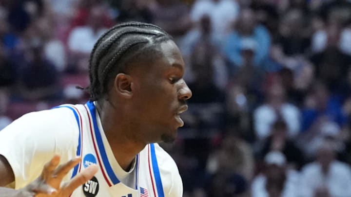 Mar 22, 2026; San Diego, CA, USA; St. John's Red Storm guard Dylan Darling (0) controls the ball against Kansas Jayhawks forward Flory Bidunga (40) in the first half during a second round game of the men's 2026 NCAA Tournament at Viejas Arena. Mandatory Credit: Kirby Lee-Imagn Images