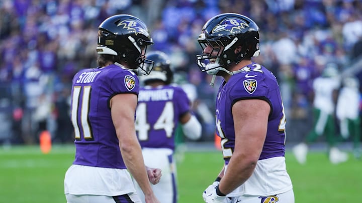 Nov 23, 2025; Baltimore, Maryland, USA; Baltimore Ravens punter Jordan Stout (11) and Baltimore Ravens fullback Patrick Ricard (42) celebrate after the game against the New York Jets at M&T Bank Stadium. Mandatory Credit: Mitch Stringer-Imagn Images