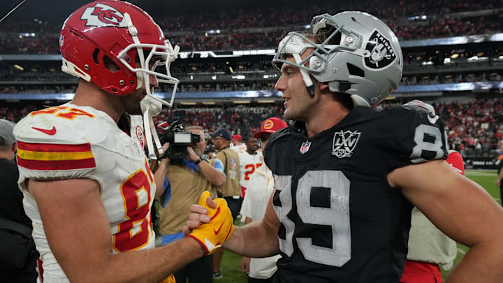 Oct 27, 2024; Paradise, Nevada, USA; Kansas City Chiefs tight end Travis Kelce (87) and Las Vegas Raiders tight end Brock Bowers (89) interact after the game at Allegiant Stadium. Mandatory Credit: Kirby Lee-Imagn Images