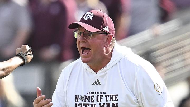 Dec 20, 2025; College Station, TX, USA; Texas A&M Aggies head coach Mike Elko reacts during the second half of the first round game of the CFP National Playoff against the Miami Hurricanes at Kyle Field. Mandatory Credit: Maria Lysaker-Imagn Images